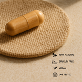 Single Amla capsule placed on a textured cloth, labeled as 100% natural, cruelty-free, vegan, and lab-tested.