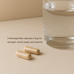 Two Ashwagandha capsules beside a glass of water with text recommending daily intake for strength, restful sleep, and stamina.