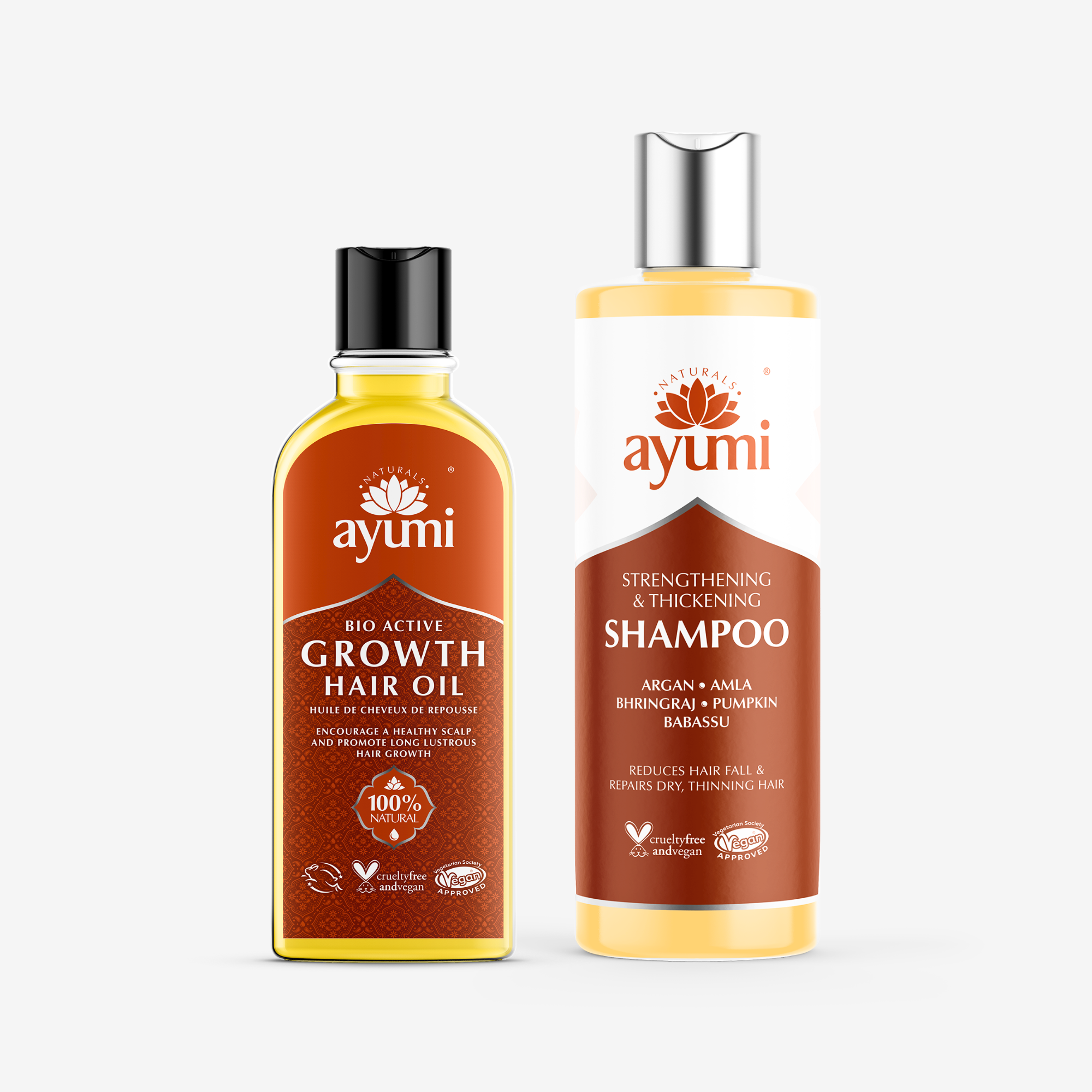 Ayumi hair care products including growth hair oil and shampoo on a white background