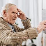Elderly man with hand on forehead looking at a calendar, representing cognitive support benefits of Shilajit in Alzheimer's