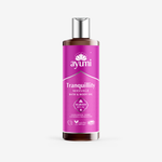 Ayumi Tranquility massage oil bottle featuring Sandalwood, Myrrh, Lavender, and Frankincense for relaxation.