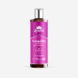 Ayumi Tranquility massage oil bottle featuring Sandalwood, Myrrh, Lavender, and Frankincense for relaxation.
