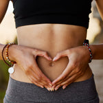A women showing heart on her belly, showing Gut Health