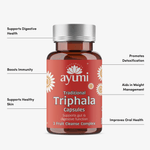 Ayumi Traditional Triphala Capsules bottle with listed benefits on a white background