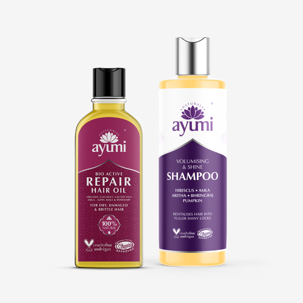 Ayumi hair care products including repair hair oil and shampoo on a white background