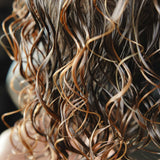 Close-up of wavy hair with a blurred background, washed hair