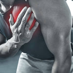 Person holding a red medicine ball, likely in a gym setting