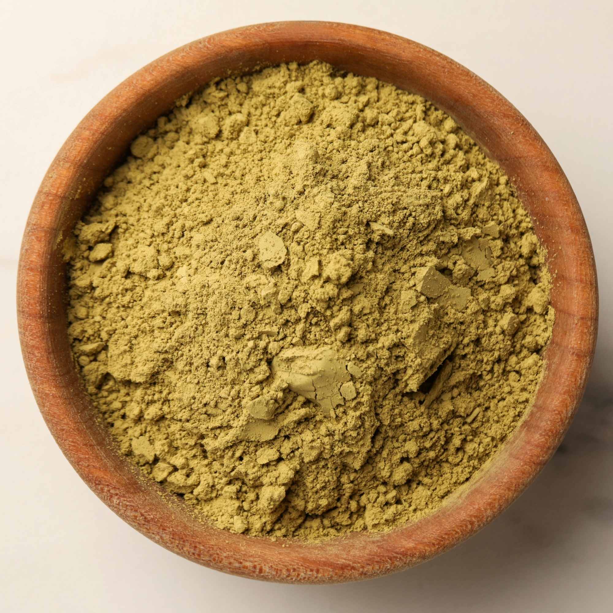 Dia Care Powder, in a wooden bowl on a white background