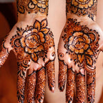 Henna designs on hands with intricate patterns