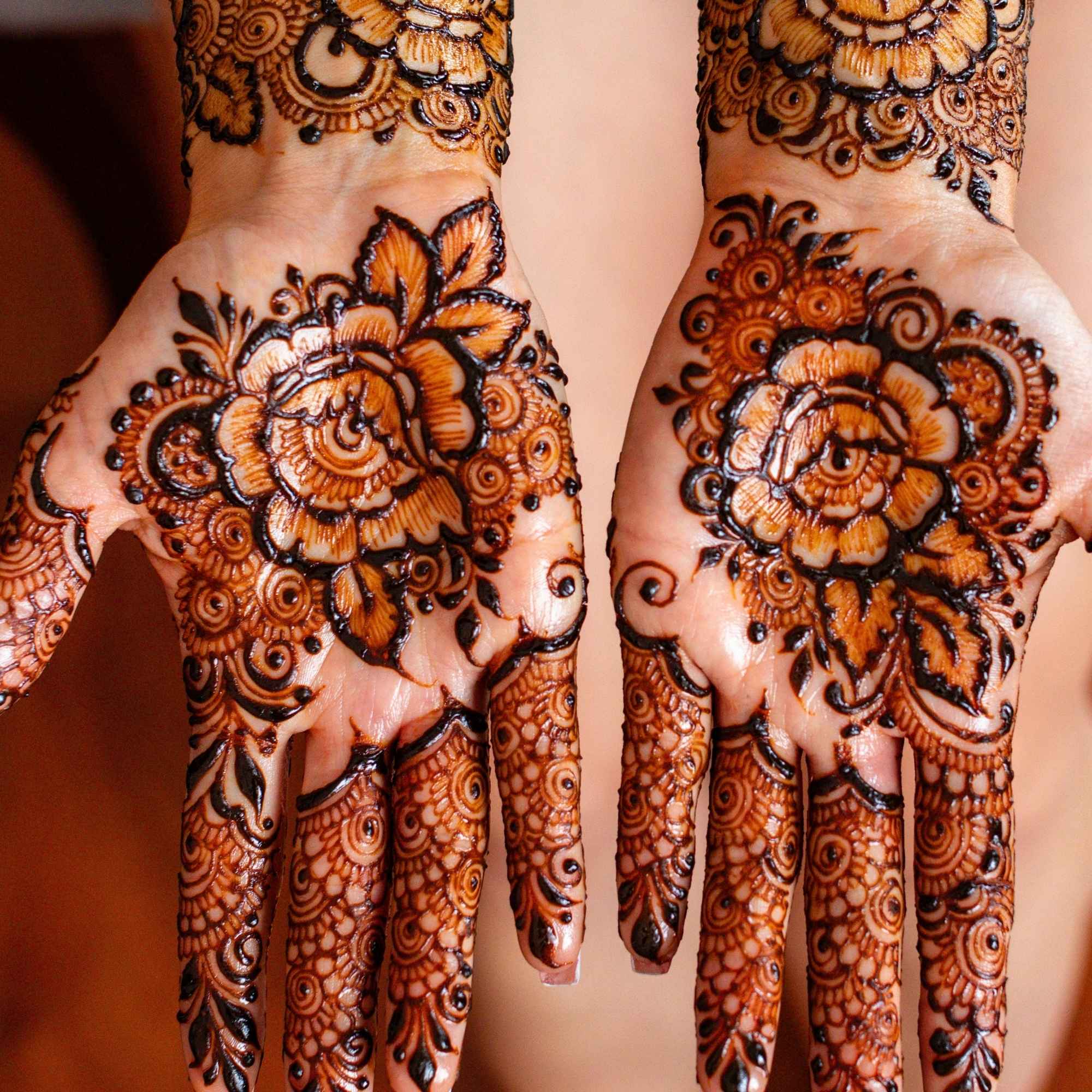 Henna designs on hands with intricate patterns
