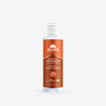 A bottle of Hydrating Toner by ayumi with a white label and orange accents, indicating it is designed for sensitive and dry skin.