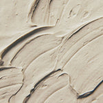 Close-up of a Ayumi Multani Mati face clay mixed with visible texture and swirls 