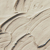 Close-up of a Ayumi Multani Mati face clay mixed with visible texture and swirls 