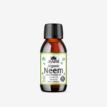 A bottle of organic neem oil with a label that includes the brand name 'ayumi' and the product name 'Neem Oil'. The bottle is amber and has a black cap.