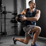 Man exercising with a medicine ball in a gym setting
