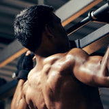 Muscular man exercising in a gym setting