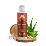 Ayumi hydrating face toner bottle with aloe vera leaves and sandalwood on a white background