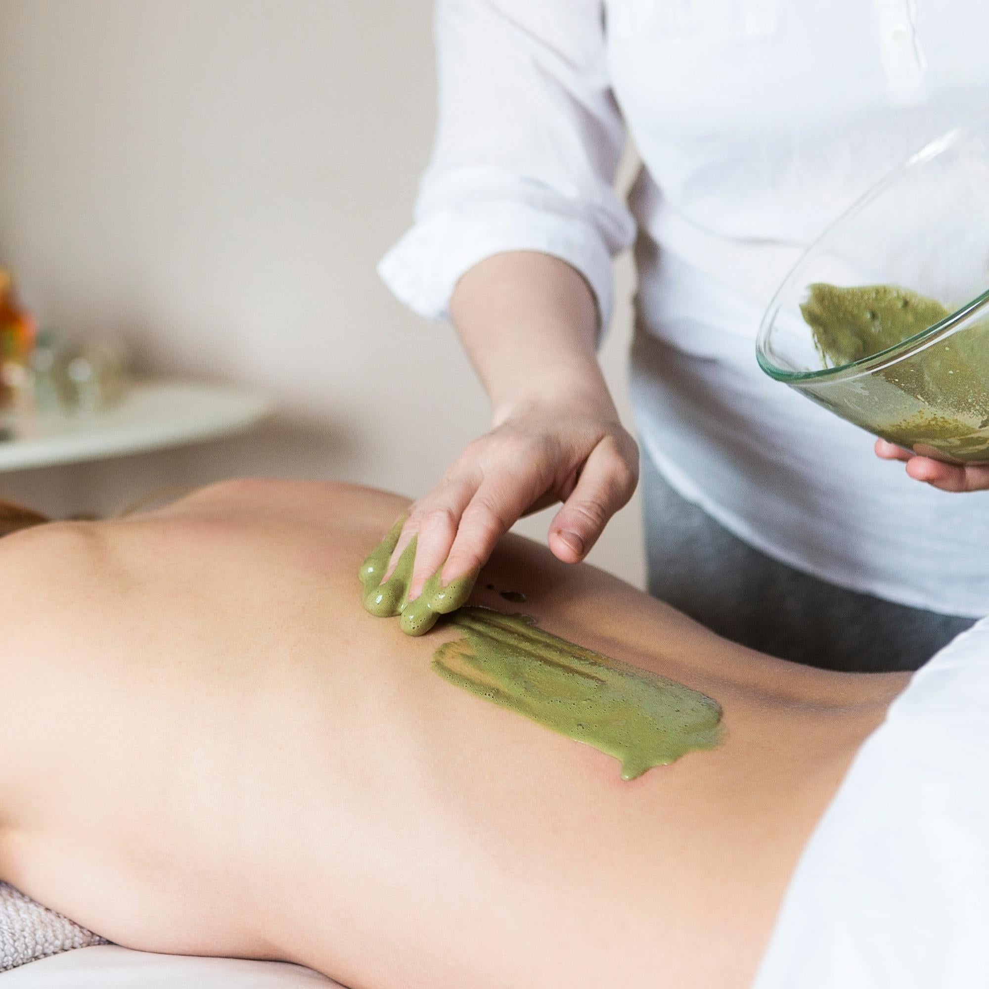 Person receiving a Tulsi Body mask treatment on their Back